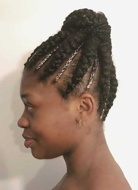 Cornrow accented bun braids hairstyle