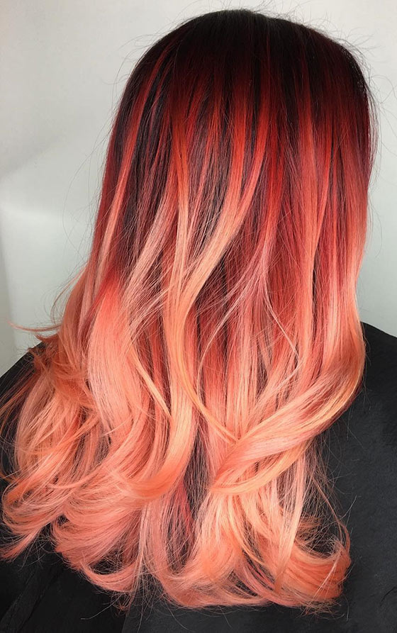 A breathtaking fiery sunset ombre on feathered ends