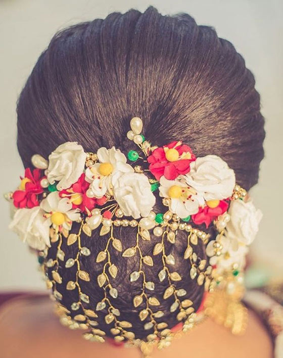 Gold floral bun Indian bridal hairstyle