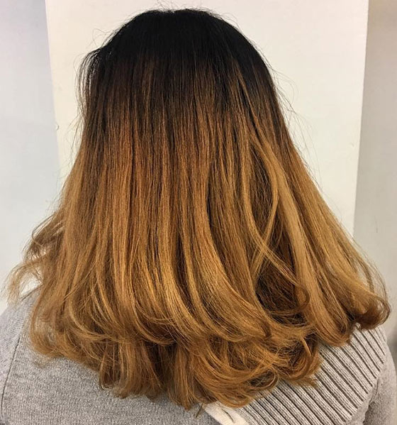 Golden ombre hair color on flicked out ends for a princess-like look
