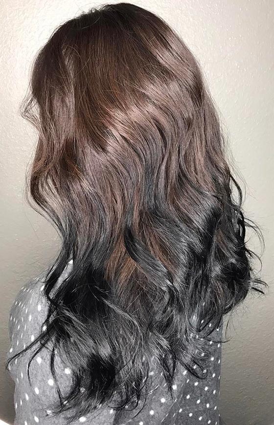 Jet black ombre on luscious curls for an edgy look