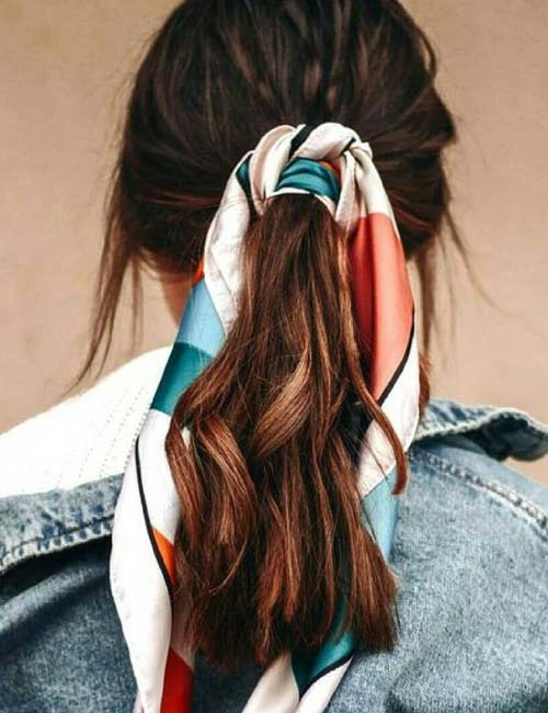 Low ponytail style with a scarf