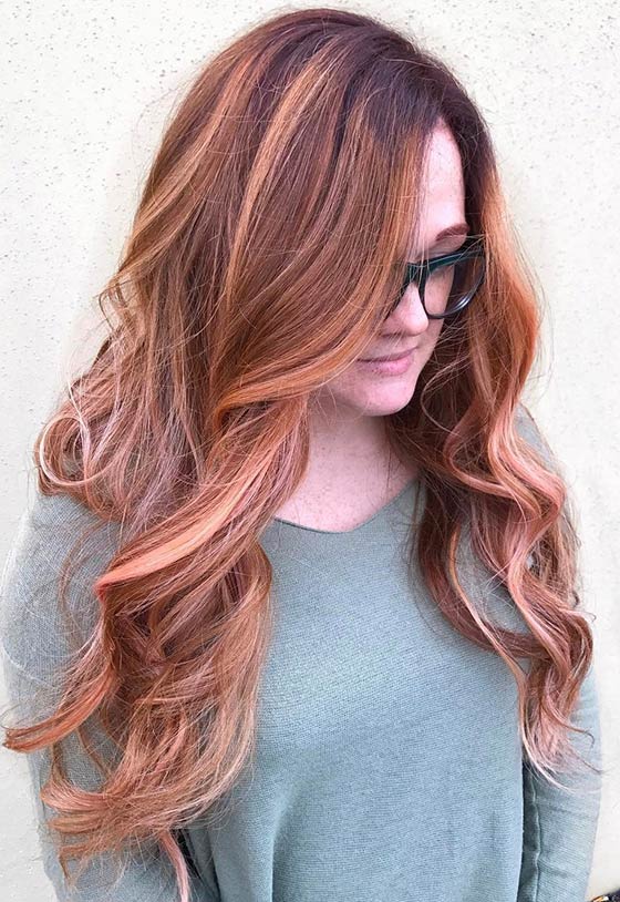 A hot mahogany apricot ombre on long layers for a fiery look