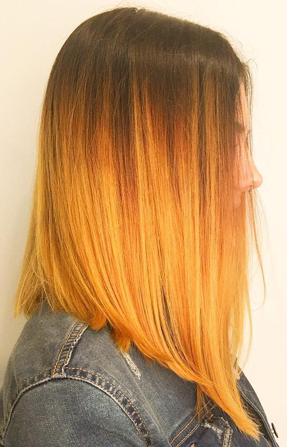 Mellow yellow ombre on angled cut hair for a cutesy look