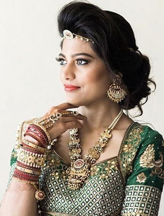 Messy side bun Indian bridal hairstyle