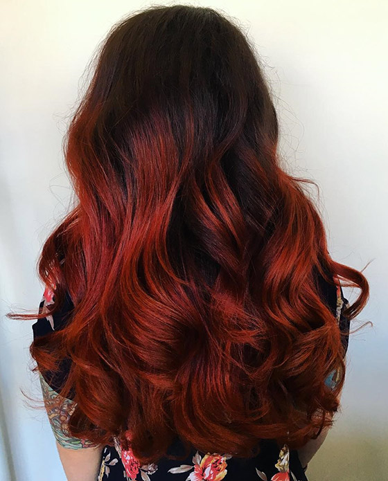 An appealing molten lava ombre on full bodied curls