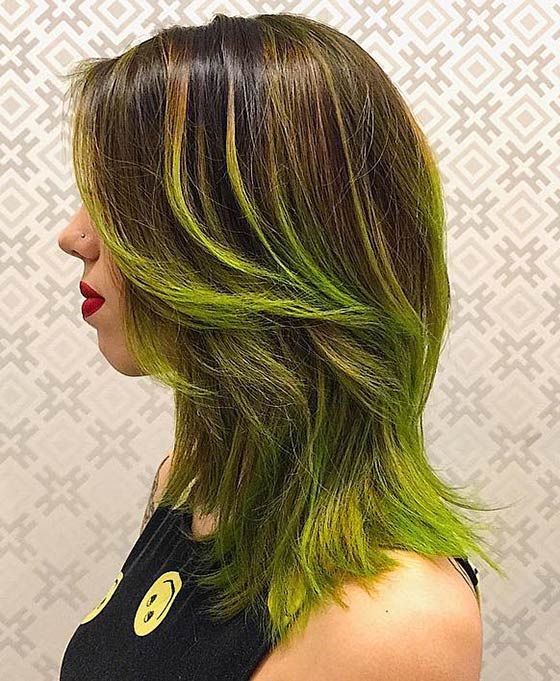 A bewitching neon green ombre on layered hair for a swamp princess look