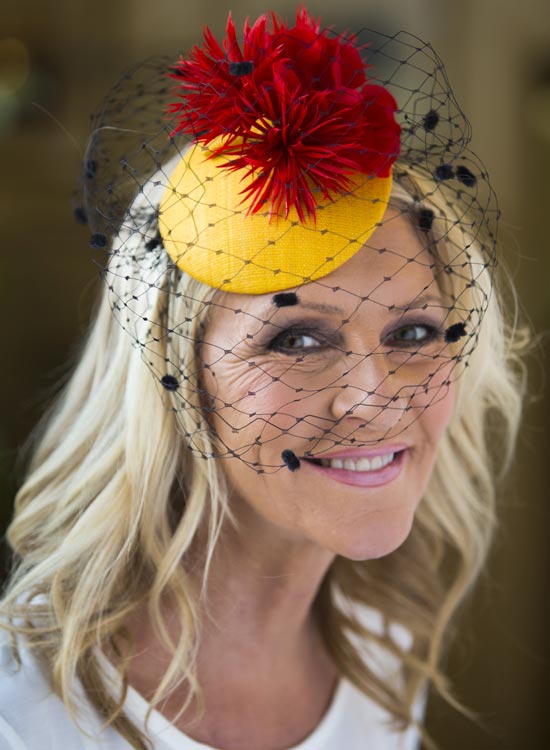 Random textured blonde waves with pretty veil medium hairstyle