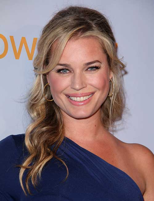 Rebecca Romijn's face frface-framingaming half ponytail hairstyle
