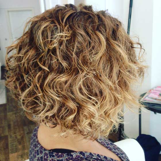 Super shaggy curly bob hairstyle for women over 40