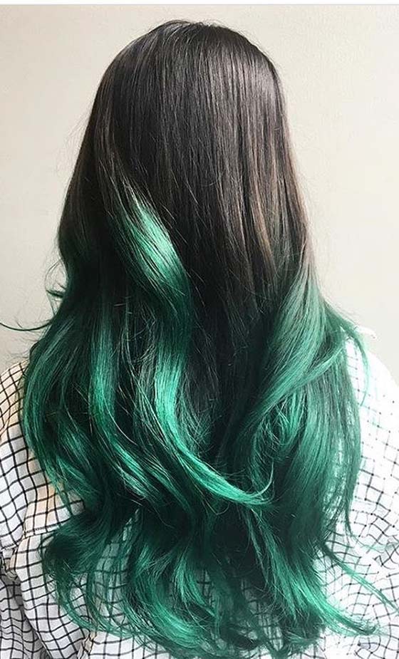 Teal green ombre on long wavy hair for a magical pixie look