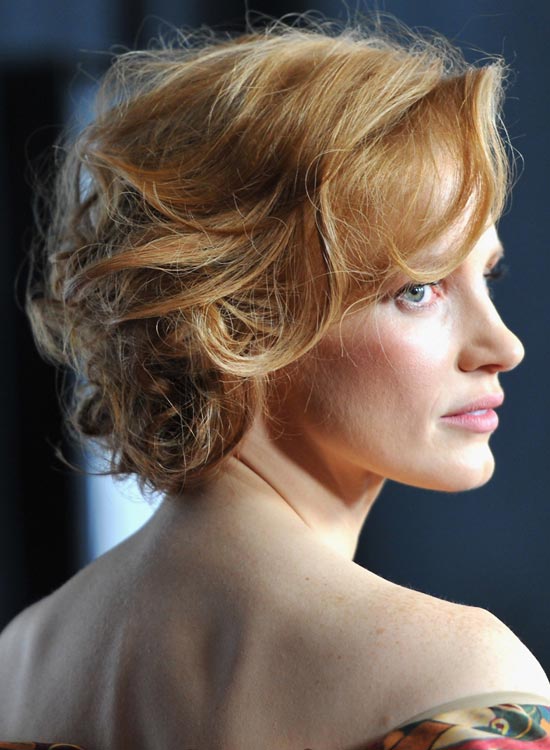 Tousled bun as bridal hairstyle for curly hair