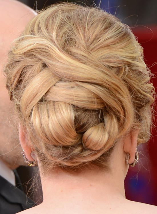 Voluminous bun as bridal hairstyle for curly hair