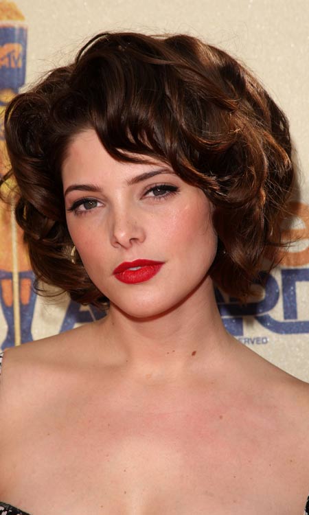 Voluminous layered bob hairstyle with textured curls