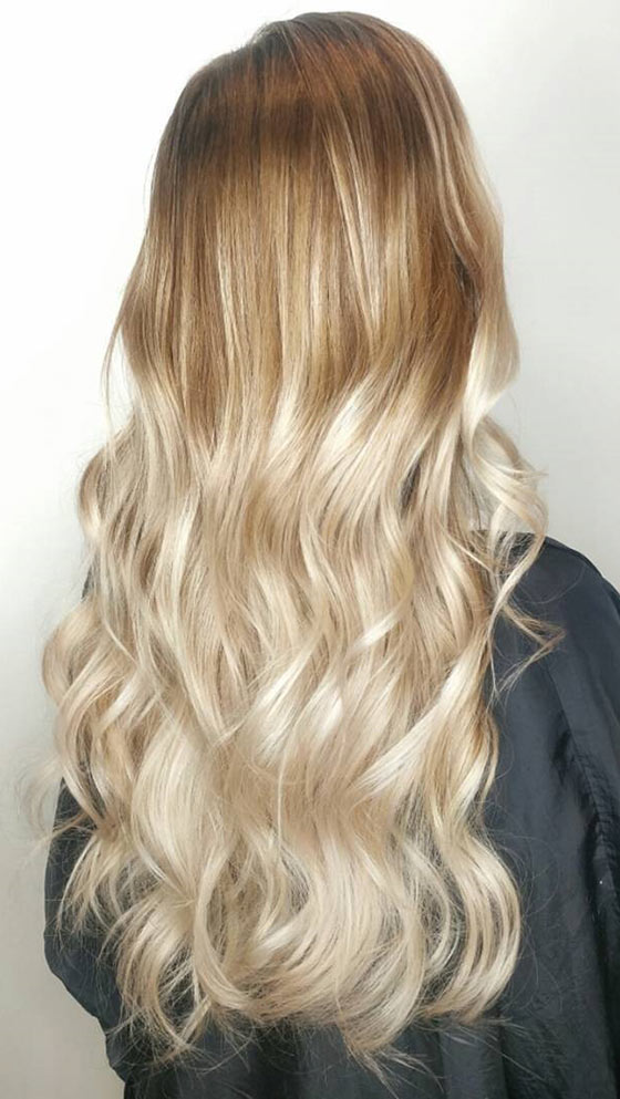 A beautiful warm blonde ombre on long waves